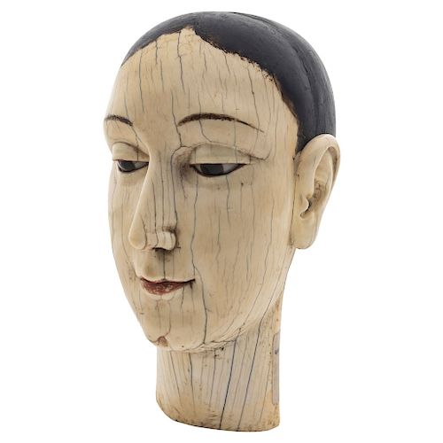 HEAD OF THE VIRGIN. HISPANIC-CHINESE, 18TH CENTURY. A carved ivory figure with traces of original polychrome and the eyes of glass