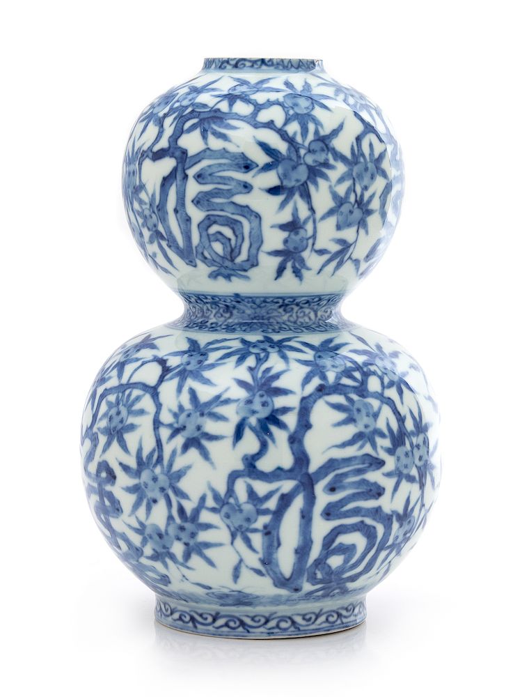 A Chinese Blue and White Gourd-Form Porcelain Vase Height 7 7/8 in., 45 cm.