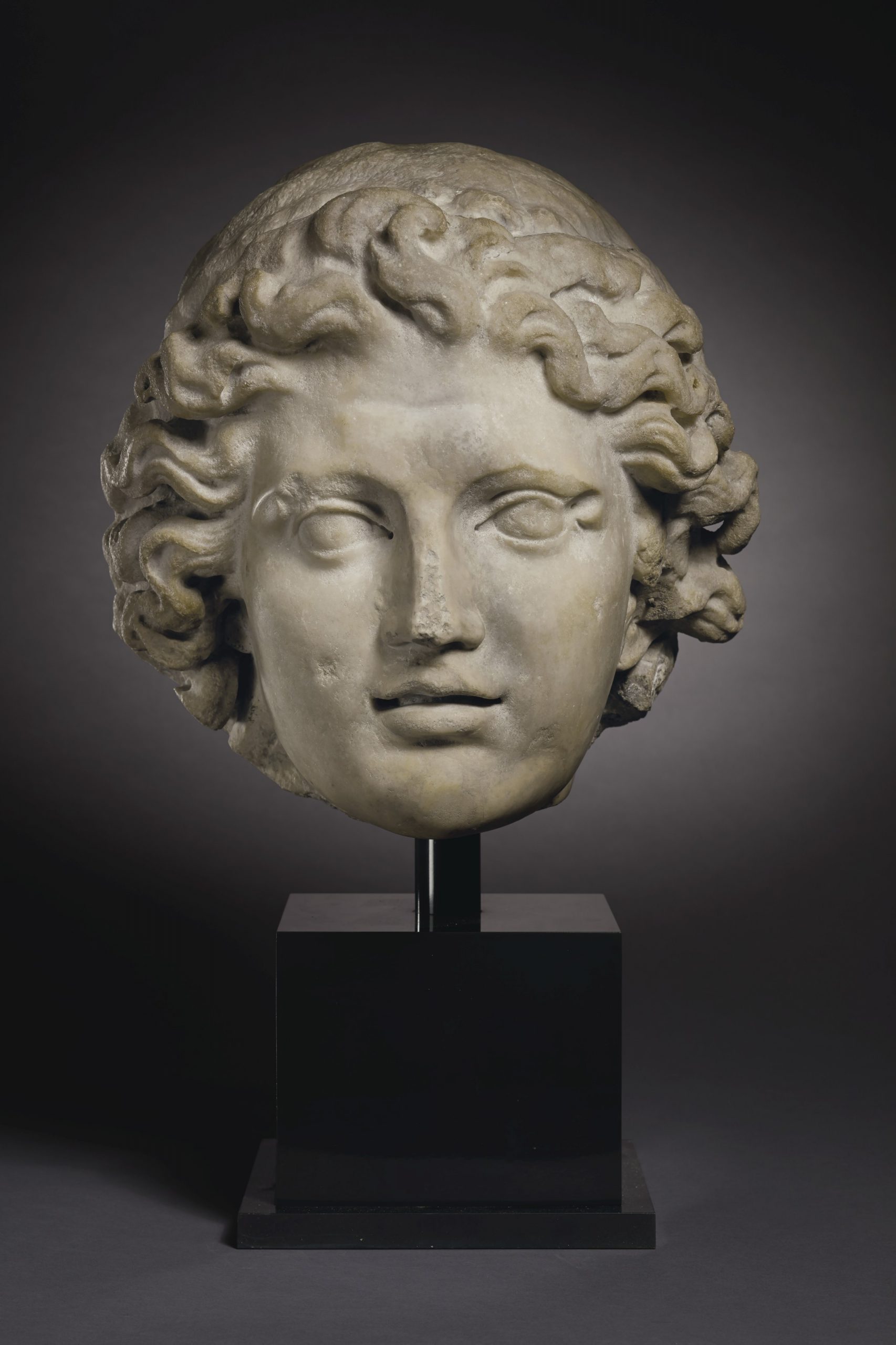 A MONUMENTAL ROMAN MARBLE PORTRAIT HEAD OF ALEXANDER THE GREAT