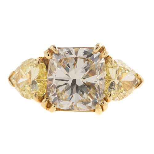A 5.50 ctw Yellow/White Cushion Cut Diamond Ring