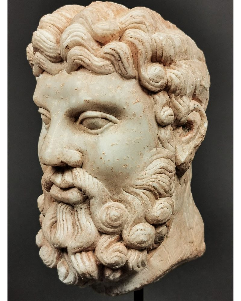 A ROMAN MARBLE HEAD OF HERCULES