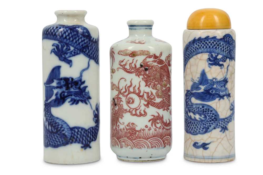 TWO CHINESE BLUE AND WHITE AND ONE UNDERGLAZE RED DRAGON SNUFF BOTTLES
