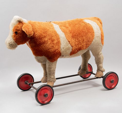 Riding toy cow. Germany. Twentieth century. Steiff brand. Made of plush. Supports with wheels