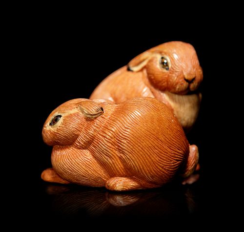 An Amber Inlaid Boxwood Leverets Ojime