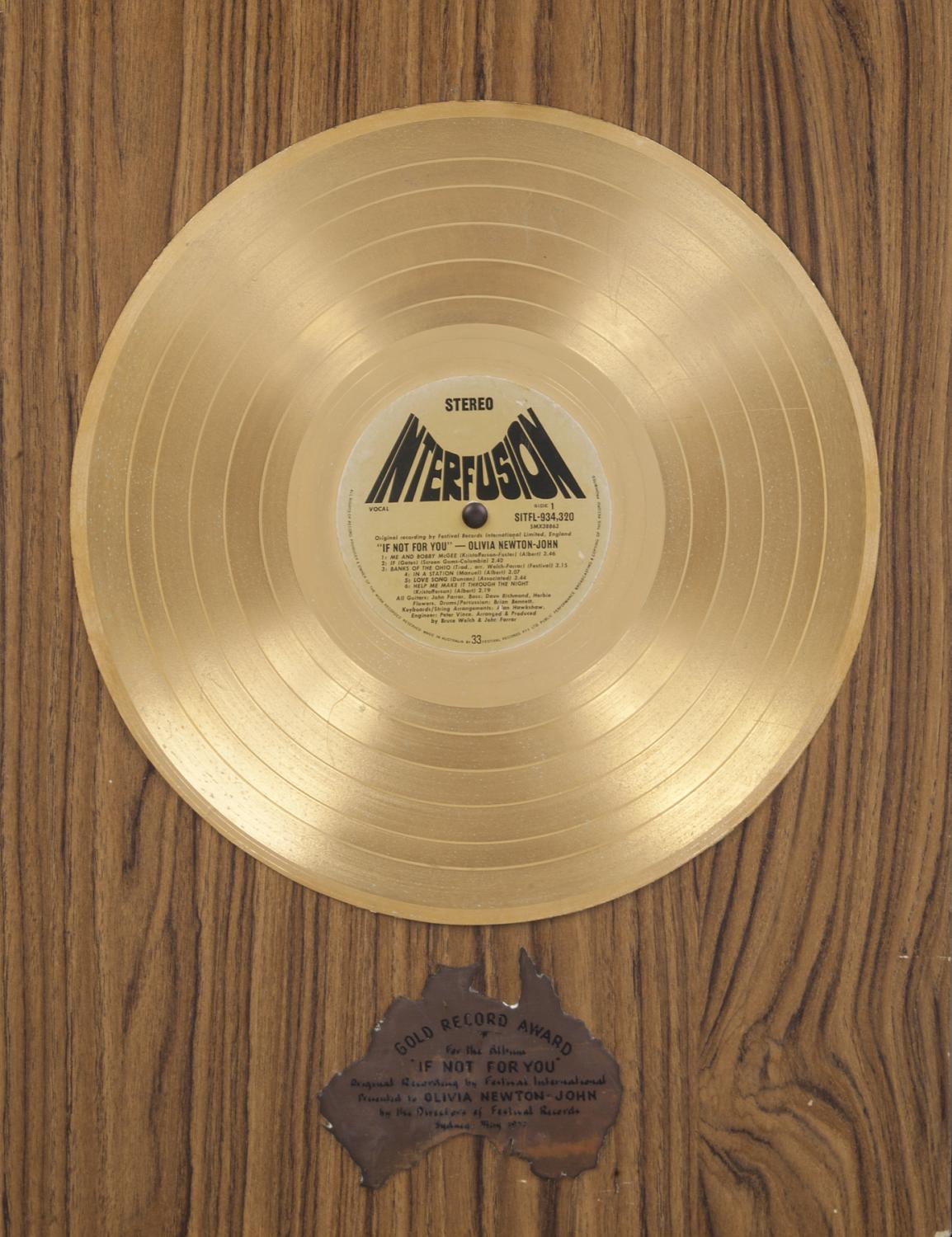 A "gold" record award presented to Olivia Newton-John for the album If Not For You by the directors of Festival Records in Sydney, Australia, in May 1972.