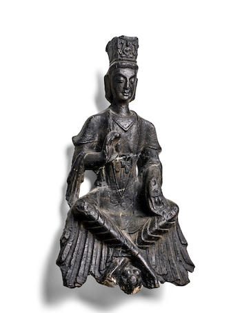 A RARE BLACK STONE FIGURE OF MAITREYA