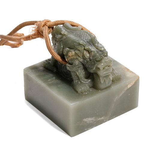 A CELADON JADE 'DRAGON' SEAL
