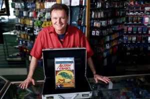 Dealer Darren Adams with his copy of Action Comics #1. Image from eBay.