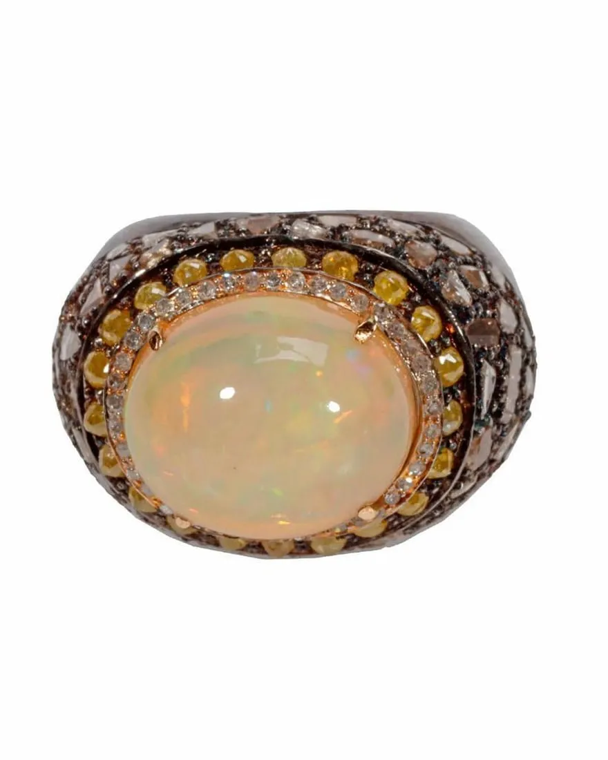 An opal, diamond, blackened silver and gold ring