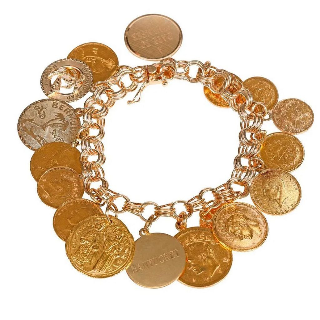 LOT 28: Gold Coin and 14k Gold Charm Bracelet. Suspending 17 assorted Middle Eastern gold coins and charms, from 14k to 22k gold; weighing approximately 67.85 grams; length: 7 1/8 in. Estimate $4,000-$6,000.
